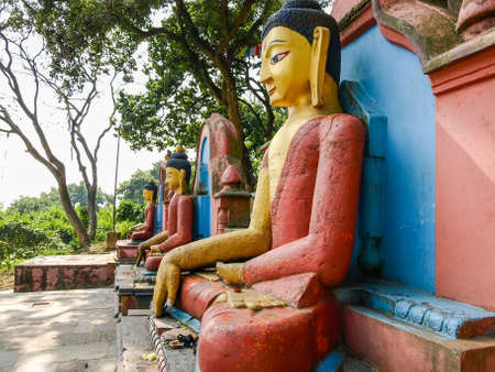 Buddha statues at the eastern foot of the Swayambu hill in the Buddhist Swayambhunath temple complex, Kathmandu, Nepalの写真素材