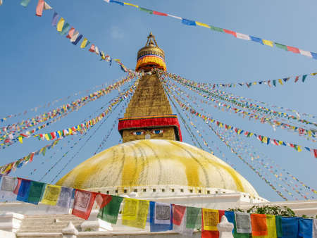 Great Stupa of Boudhanath among of prayer flags on a background of sky, Kathmandu, Nepalの写真素材