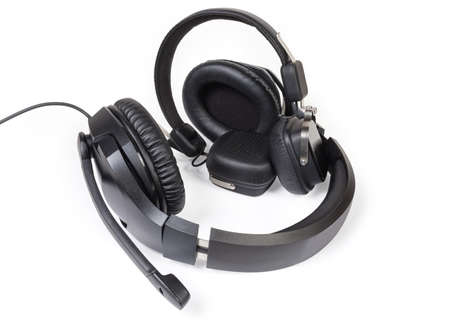 Wired high-fidelity headset with full size headphones and wireless ear speakers on a white...