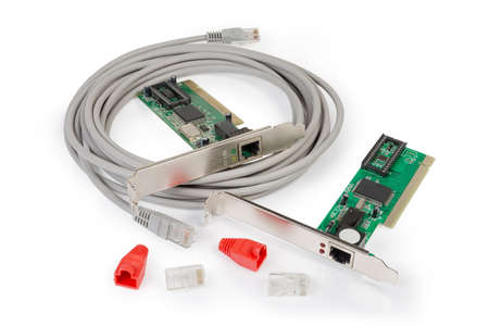 Connectors and red protective caps for twisted pair, patch cord and two different network controller cards on a white backgroundの写真素材