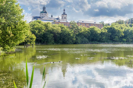 Former fortified Monastery of the Order of Discalced Carmelites of the 17th century. View from river side, Berdychiv, Ukraineの写真素材