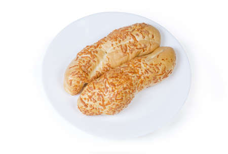 Two baked pastry cheese sticks on the white dish on white background