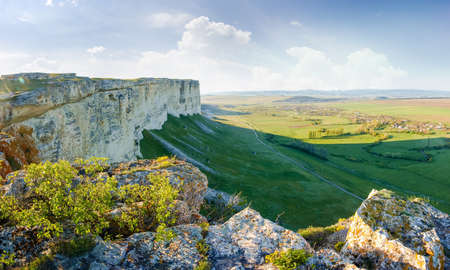 View of valley from the steep edge of limestone plateau in the morning, panoramic viewの写真素材