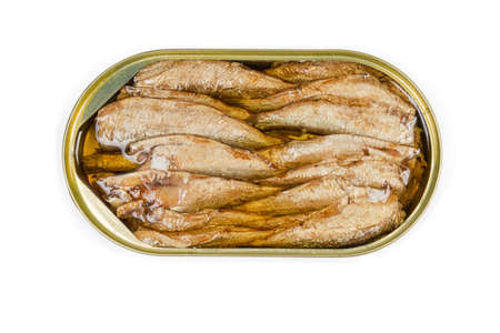 Smoked canned sprats in cooking oil in open tin can on a white background, top view close-upの写真素材