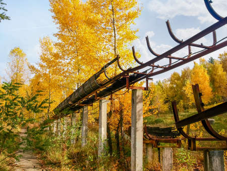 Ruins of the old abandoned luge track made with steel framework and wooden chute covering in autumn, Ukraine
の写真素材