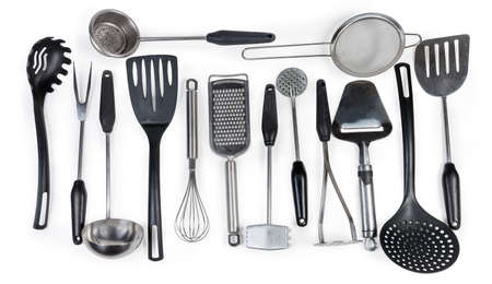 Items of cooking utensils for various purposes made with stainless steel and plastic and laid out on...