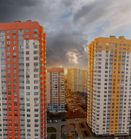Typical modern multistory apartment buildings in housing estate of big city at sunset, fragment,...