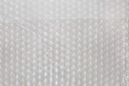 Fragment of sheet of plastic transparent bubble pack close-up, texture, background