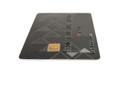 Plastic smart bank card contact-type with a chip on a white background close-up in selective focusの写真素材