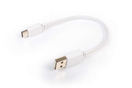 Short white cable with plugs USB-A and USB-C at the edges on a white surface