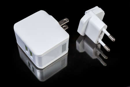 AC adapter for mobile equipment batteries charging with two output USB ports and combined North...