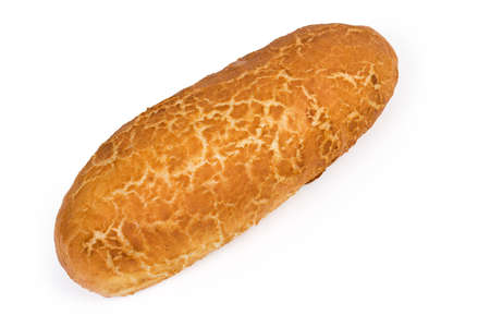 Whole oval loaf of wheat bread with netted crust on a white background, top view