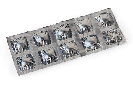 Foil pack with a pharmaceutical drugs in the form of pills on a white backgroundの写真素材