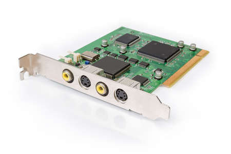 Old internal analog video capture card used in desktop computers on a white surface, close-up in...