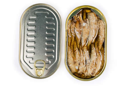 Smoked canned sprats in cooking oil in open tin can and sealed tin can on a white background, top viewの写真素材