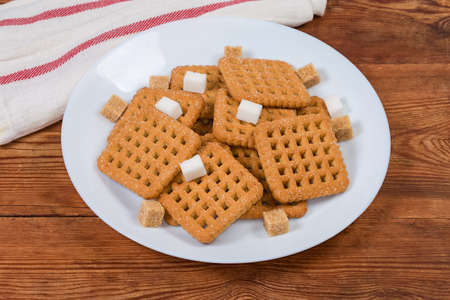 Flat crunchy square-shaped shortbread cookiesの写真素材