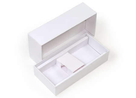 Empty rectangular cardboard packing box with removed lid and cardboard spacer insert on a white...
