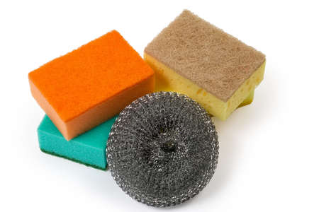Kitchen sponge made of steel strip and colored synthetic sponges with harder layer on a white backgroundの写真素材