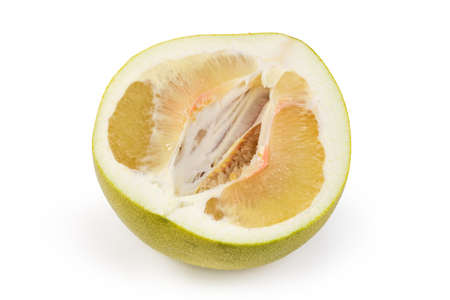 Half of a ripe pomelo fruit cut along on a white backgroundの写真素材