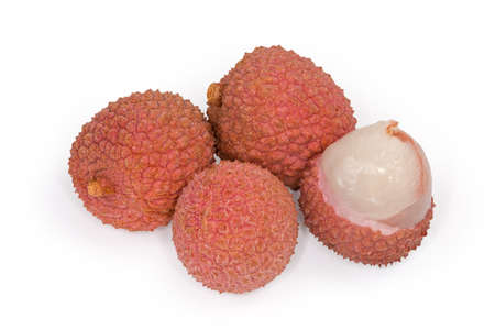 Whole and one partly opened ripe lychee fruits on a white background close-upの写真素材