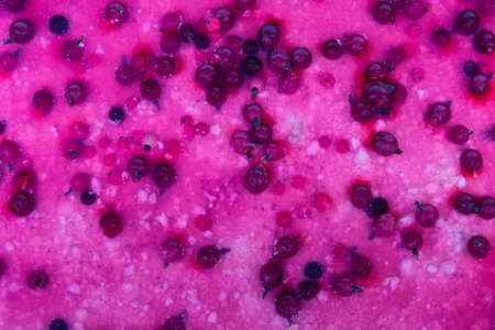 Surface of the berry cake with jelly coating and fresh red and black currant berries, top view,...