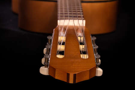 Classical headstock with machine head for tuning of the old traditional wooden acoustic guitar with...