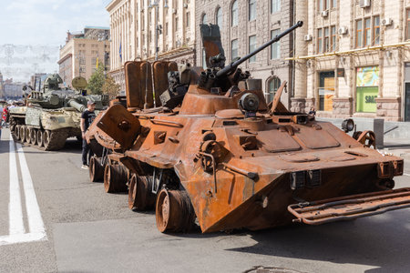 Kyiv, Ukraine - August 22, 2022: Exposition of Russian military equipment destroyed in Russian invasion of Ukraine, wrecked burnt rusty armored personnel carrierのeditorial素材