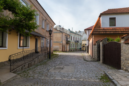 Street of the Old Town quarter with building 17-19th centuries in spring morning in Kamianets-Podilskyi city, Ukraineの写真素材