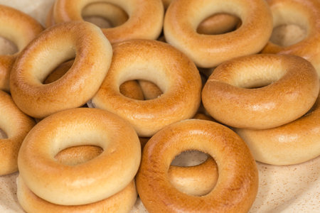 Crunchy ring-shaped small cookies, so called sushki in the Eastern European cuisine on dish, close-up in selective focusの写真素材