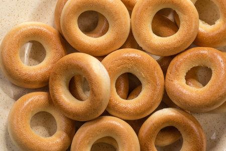 Crunchy ring-shaped small cookies, so called sushki in the Eastern European cuisine on dish, top view close-upの写真素材