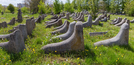 Panoramic view of the part of the ancient Jewish cemetery with old stone tombstones in the form of the felt boots in spring sunny day, Berdychiv, Ukraineの写真素材