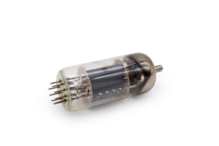 Old vintage electronic vacuum tube with top cap connections for higher voltages on an anode lies on...
