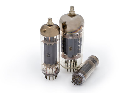Three different old electronic amplifying vacuum tubes on a white backgroundの写真素材