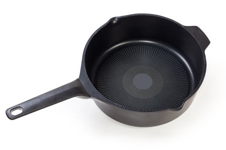 Modern empty deep frying pan made of cast aluminum with titanium non-stick coating and opposite helper handle on a white backgroundの写真素材