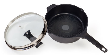 Empty deep frying pan made of cast aluminum with titanium non-stick coating with removed lid of glass and stainless steel on a white backgroundの写真素材
