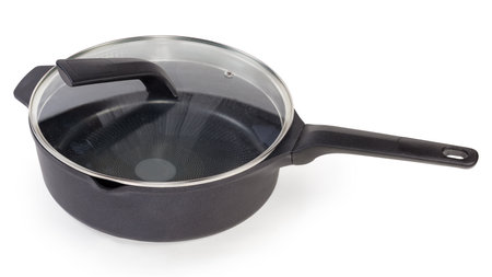 Empty deep frying pan made of cast aluminum with titanium non-stick coating closed with lid of glass and stainless steel on a white backgroundの写真素材
