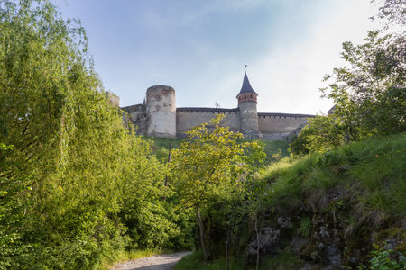 Ancient fortress of the 14-18th centuries, view from the canyon of the southwestern wall and towers in sunny morning, Kamianets-Podilskyi, Ukraine.のeditorial素材