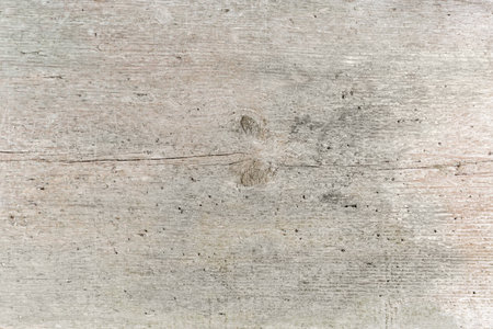 Texture of the old wooden not handled softwood plank with roughly surface, small cracks and knots, backgroundの写真素材