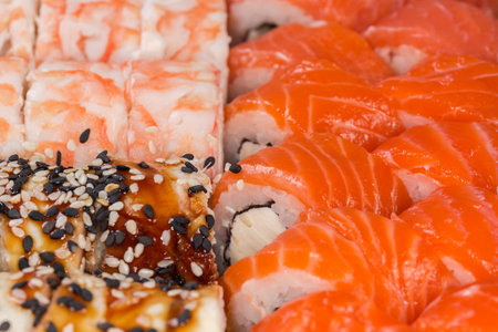 Set of the various sushi in open packaging, fragment close-up in selective focusの写真素材