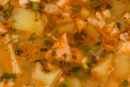 Surface of the clear salmon soup in bowl, top view close-up, backgroundの写真素材