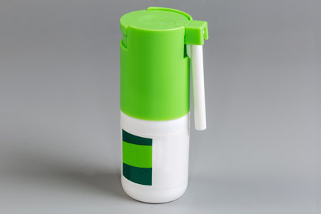 White-green small plastic bottle of medicinal spray for the treatment of the nose and throat...