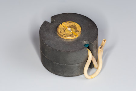 Old used compact high frequency transformer with pot type ferrite core designed for using in...