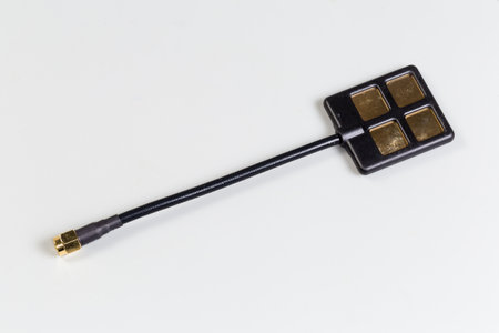 Small-sized flat antenna of high-frequency electronic unit with coaxial connector on the edge of...