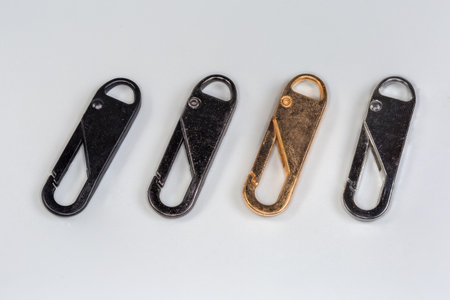 Small metal non-locking snap hooks with coating of black, gray, yellow and silvery colors for...