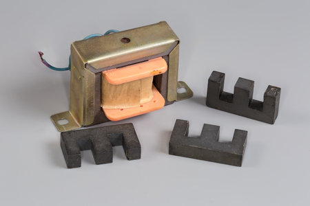 Old small-sized mains shell type transformer designed for household or industrial device power...