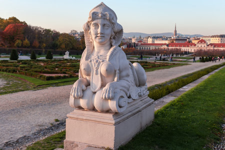 White stone Sphinx sculpture in Belvedere Gardens illuminated by the evening sun at autumn, Vienna, Austriaの写真素材