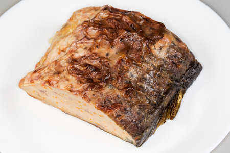 Piece of stuffed fish carp, made from a mixture of ground deboned carp with carrot stuffed inside...