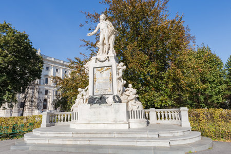 Mozart monument created in the 19th century, now located in the City garden in autumn sunny day, Vienna, Austria.の写真素材