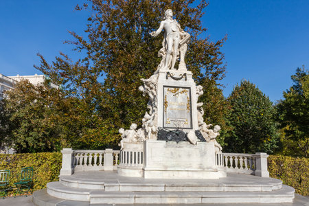 Mozart monument created in the 19th century, now located in the City garden in autumn sunny day, Vienna, Austria.の写真素材