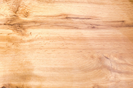 Texture of the wooden surface made of knotty partly cracked oak planks, top view, backgroundの写真素材